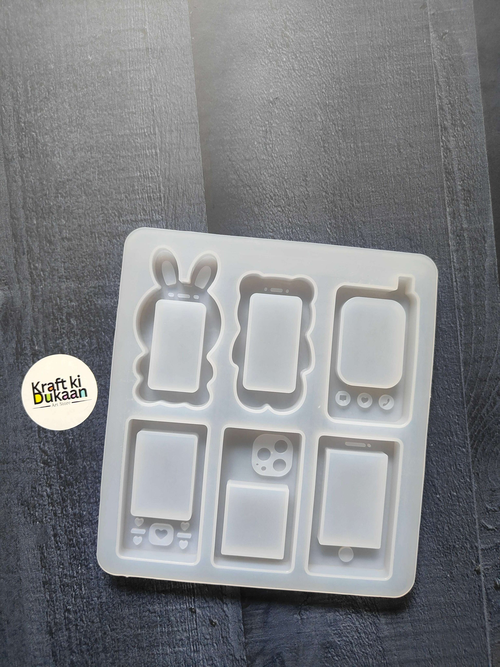 6-cavity mobile phone mould tray with six handset case cavities, white silicone