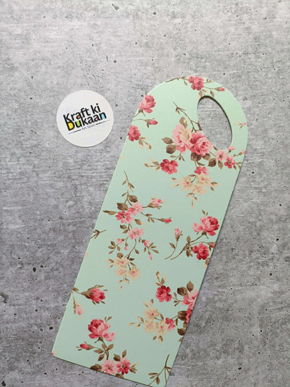 Small floral card holder, mint green with red-pink blossoms and round handle hole