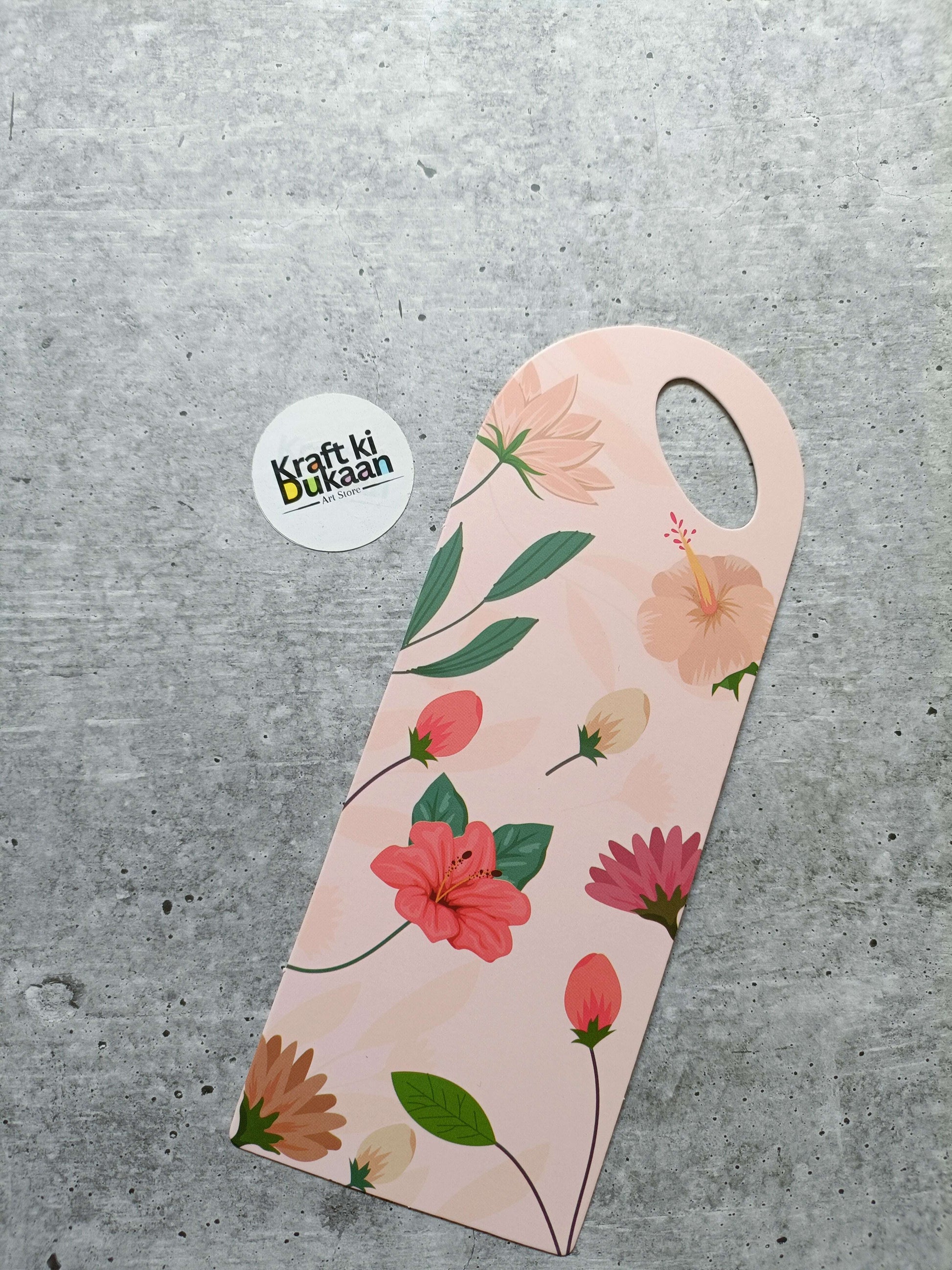 Small floral card holder, light pink background with multicolor flowers and round handle hole