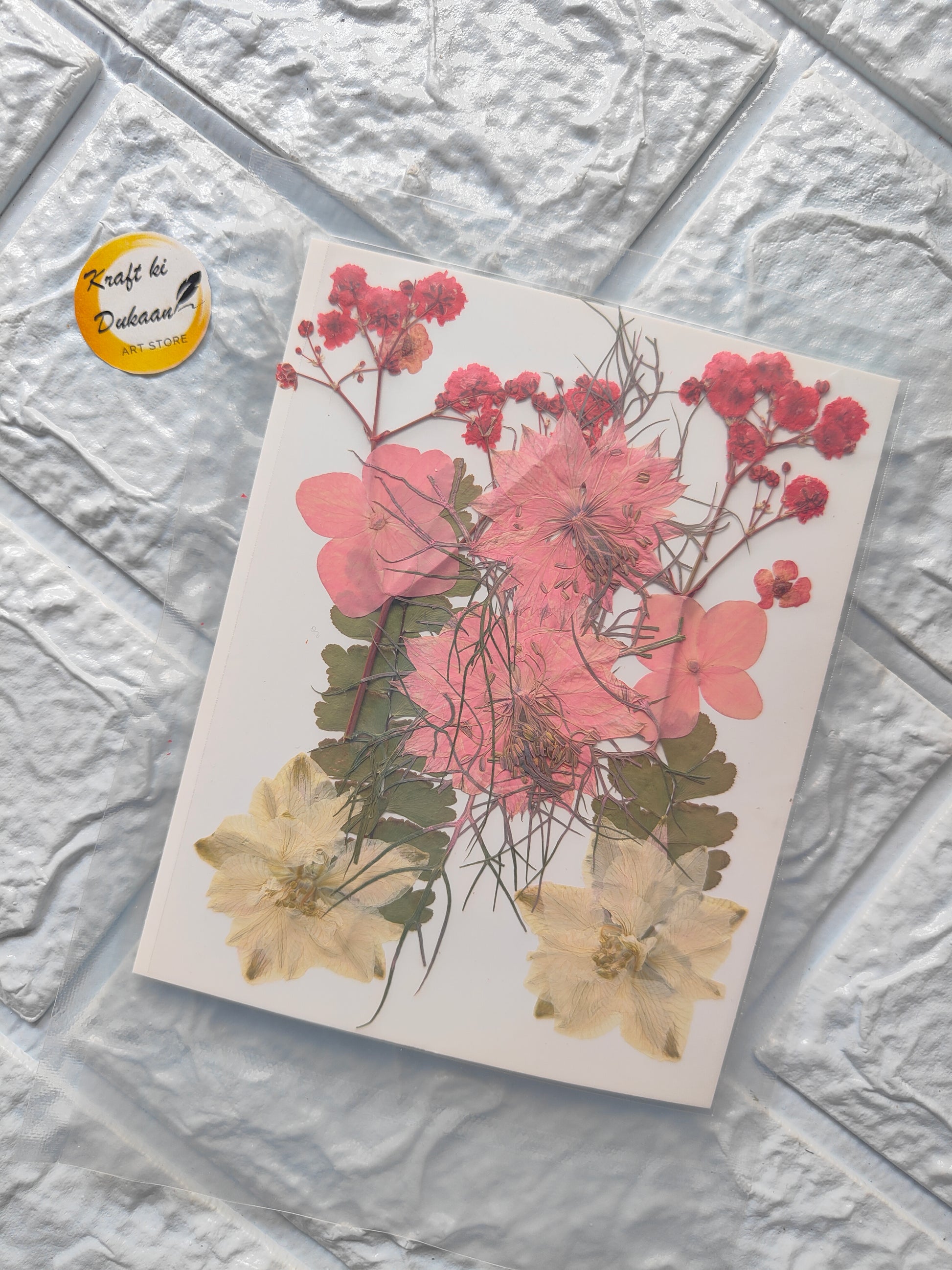 A3 pressed flower sheets featuring vibrant pink and yellow floral designs on a textured background