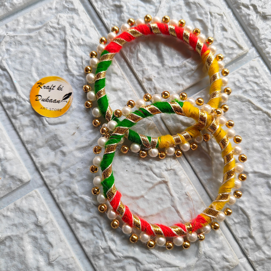 Colorful 3 inch gota ring craft supply with green red and yellow threads decorated with gold beads