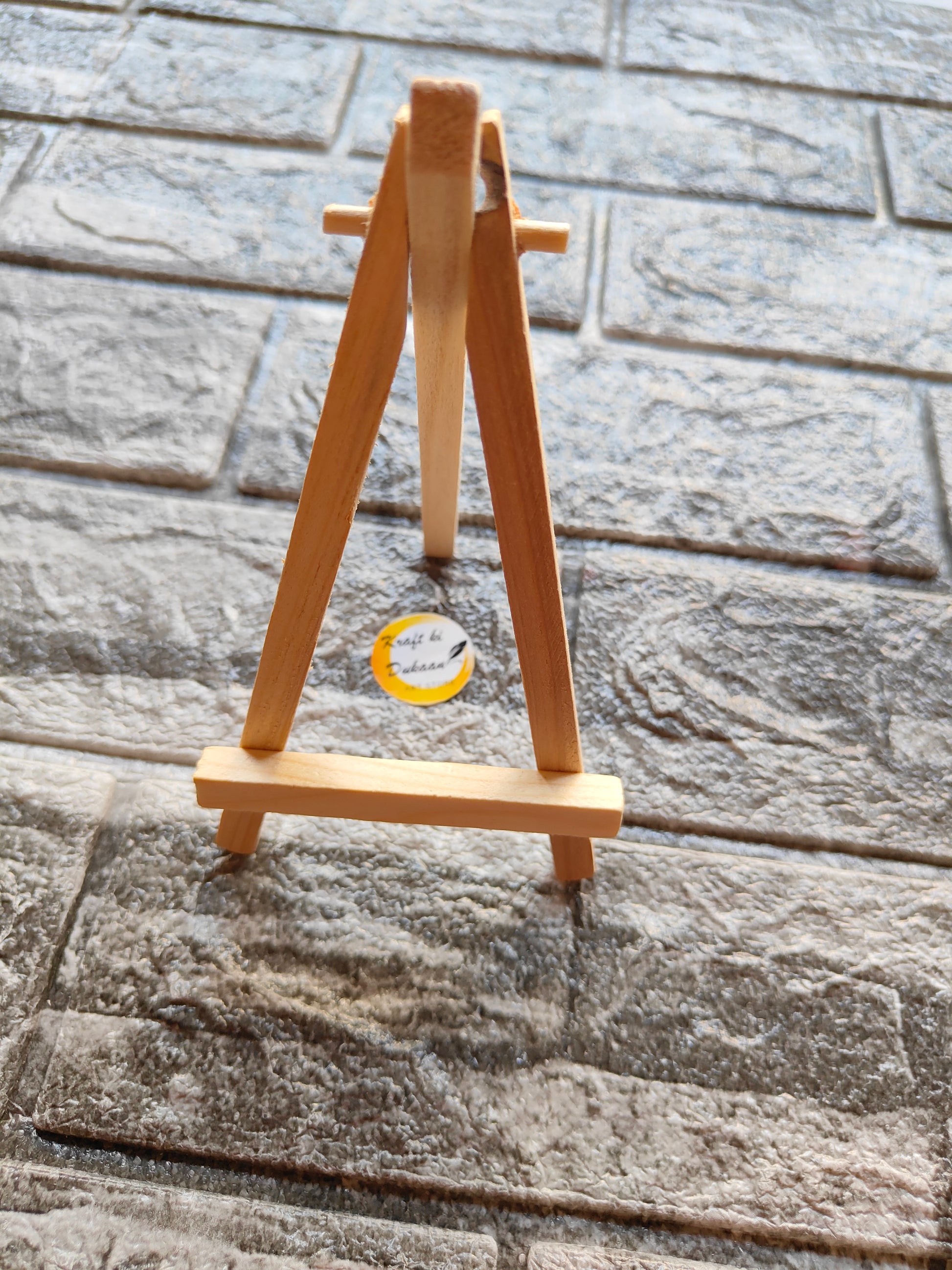 7 inch wooden easel stand on textured stone floor by Kraft ki Dukaan