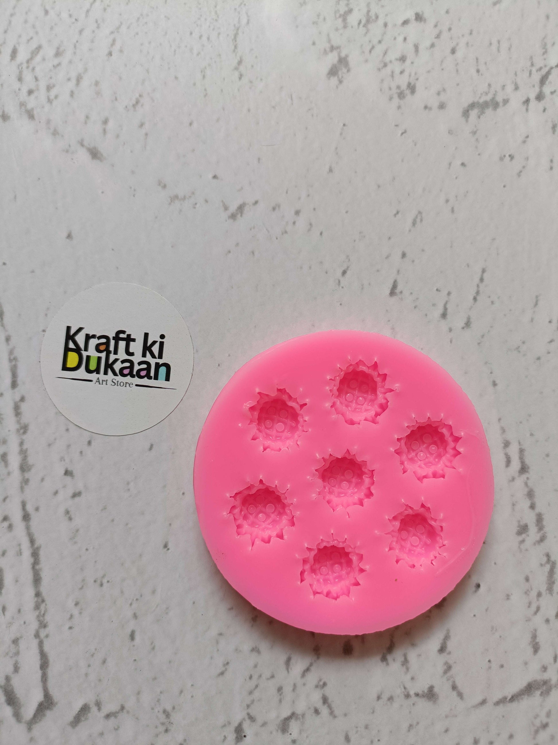 Pink flower silicone mould with 7 cavities, round mold with embossed flower shapes