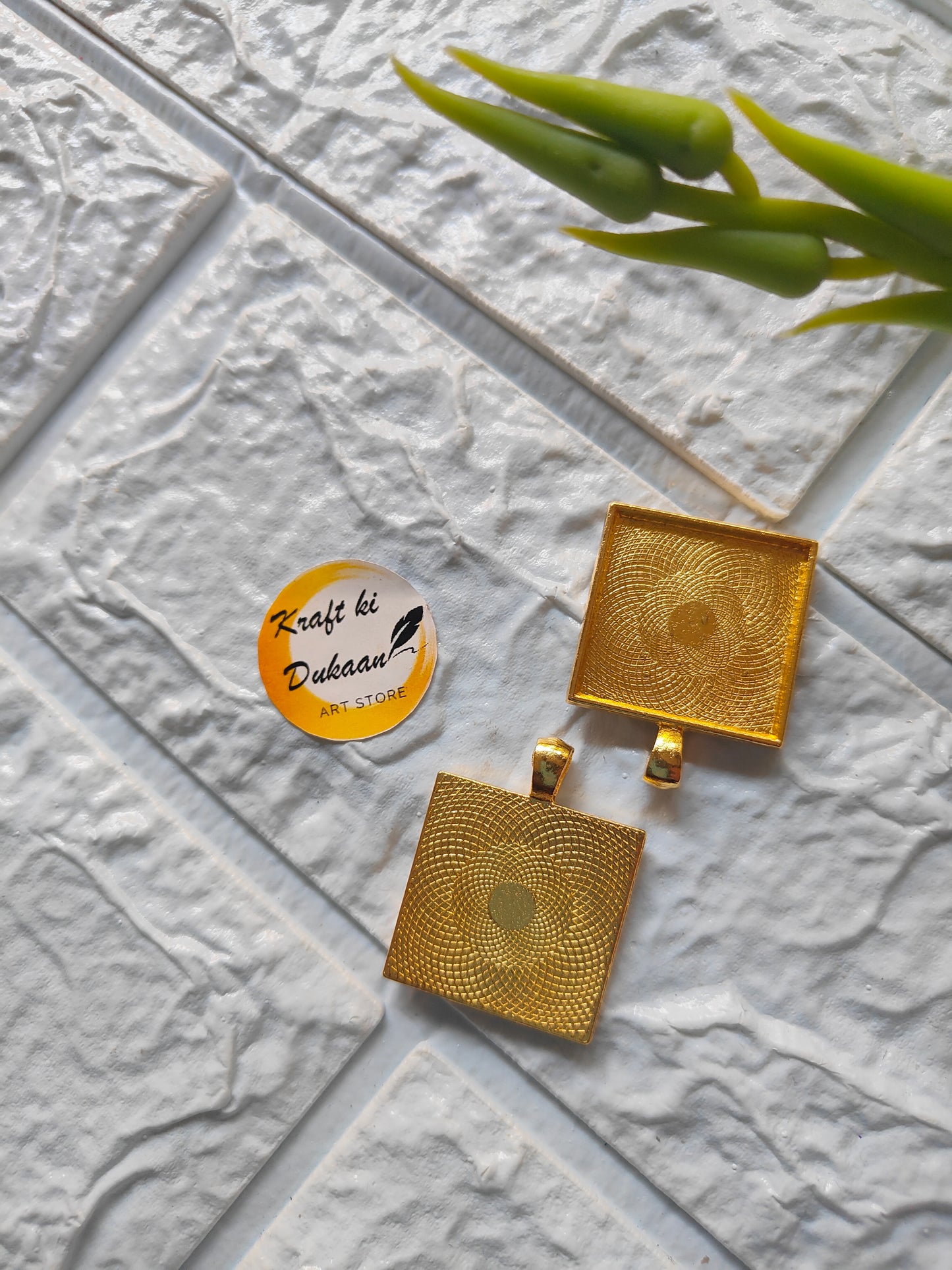 Gold bezel pendant tray set for resin art featuring intricate designs and hanging loops