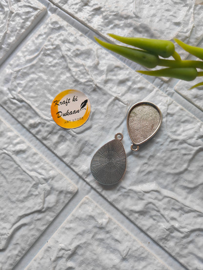 Bezel pendant tray set for resin art featuring a teardrop shape and intricate design