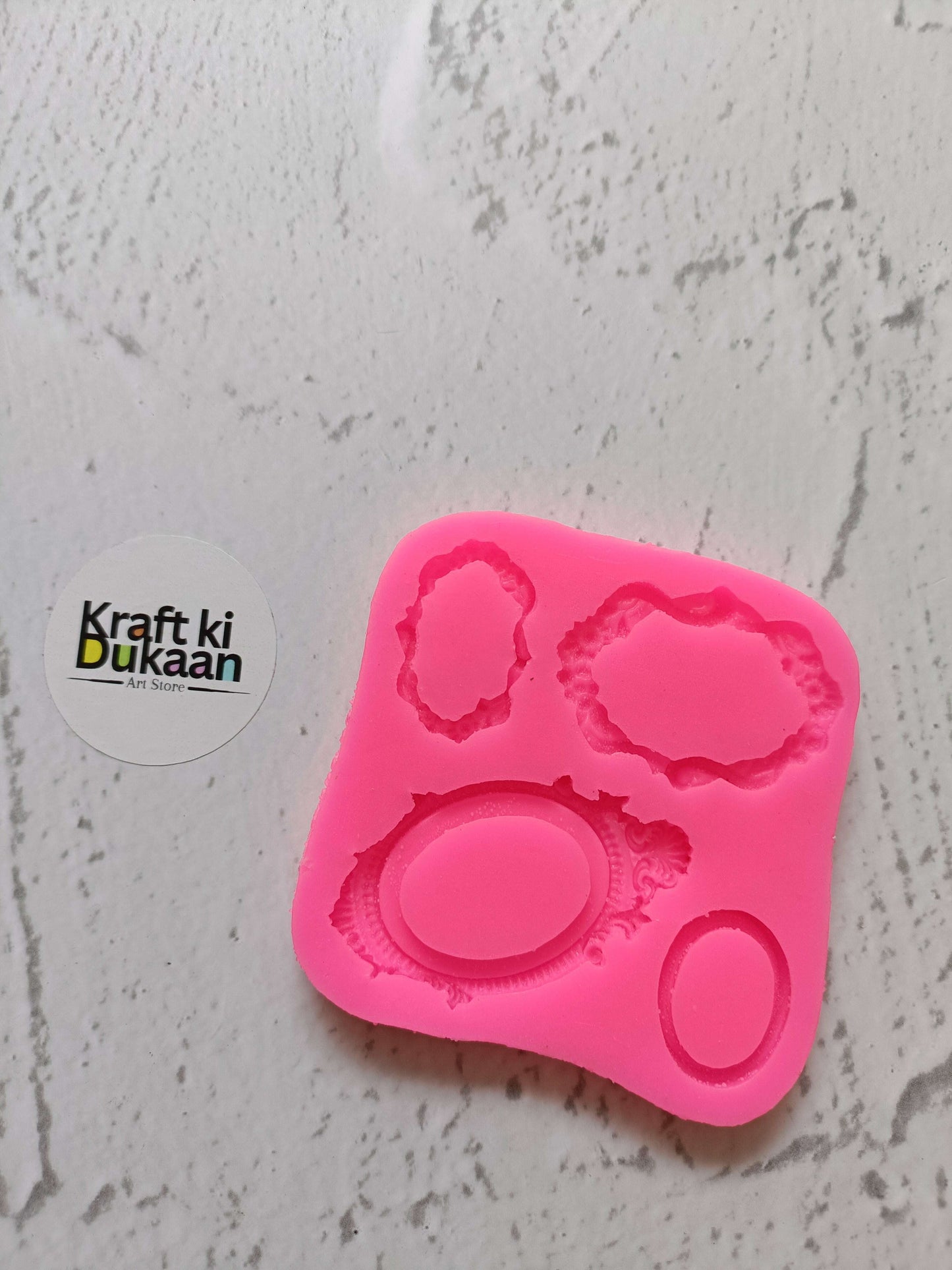 Pink 4-cavity mirror mould with round and oval embossed shapes