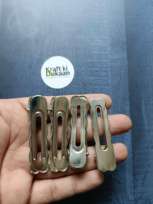 Metal silver hair clips with curved teeth, shown in a set of 6cm clips