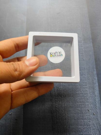 Display Box 7x7cm, white frame with transparent window and “Kraft ki Dukaan” logo