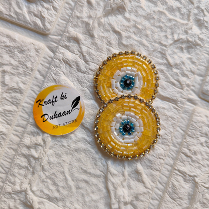 Evil eye embroidered patches in vibrant colors with beaded accents by Kraft ki Dukaan