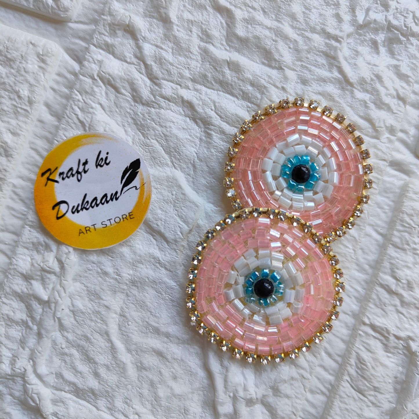 Evil eye embroidered patches in pink and blue with intricate beading from Kraft ki Dukaan