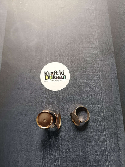 Gold-tone ring bases (2 shown), round bezels on open adjustable bands