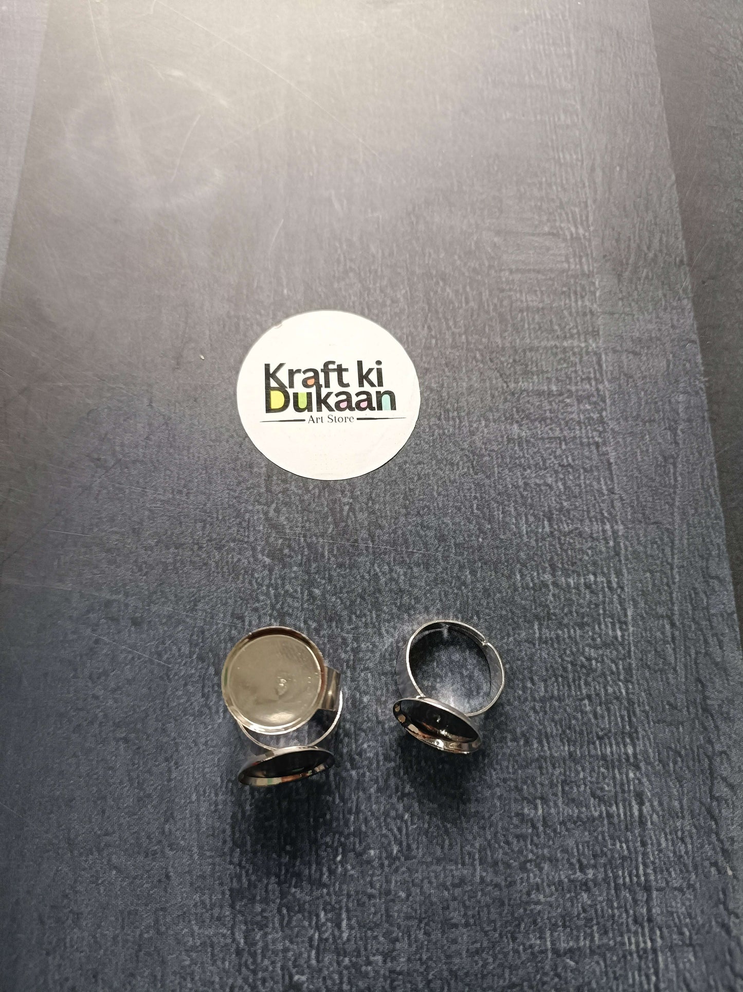 Ring bases (2 shown), gold- and silver-tone round bezels on open bands