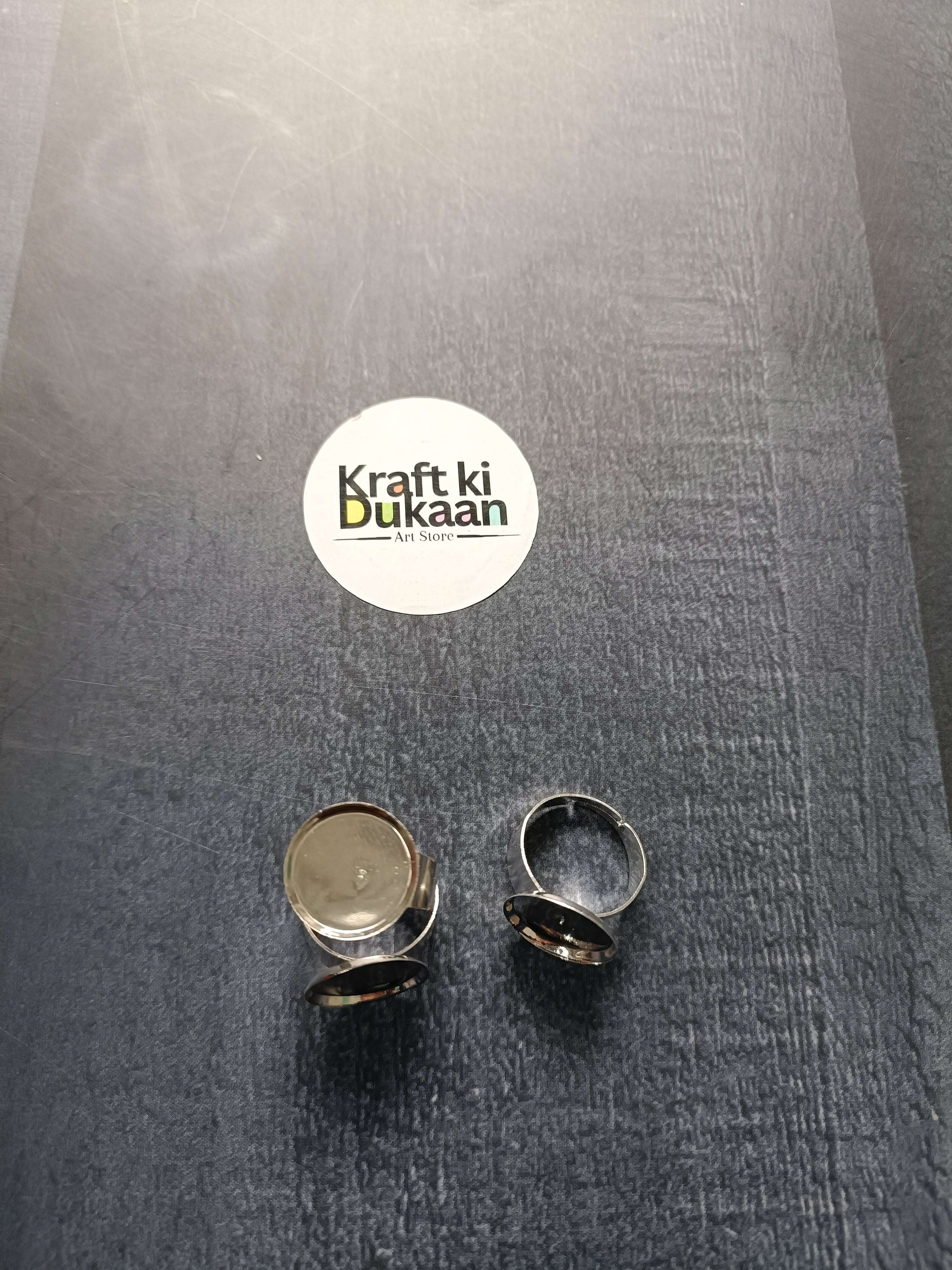 Ring bases (2 shown), gold- and silver-tone round bezels on open bands