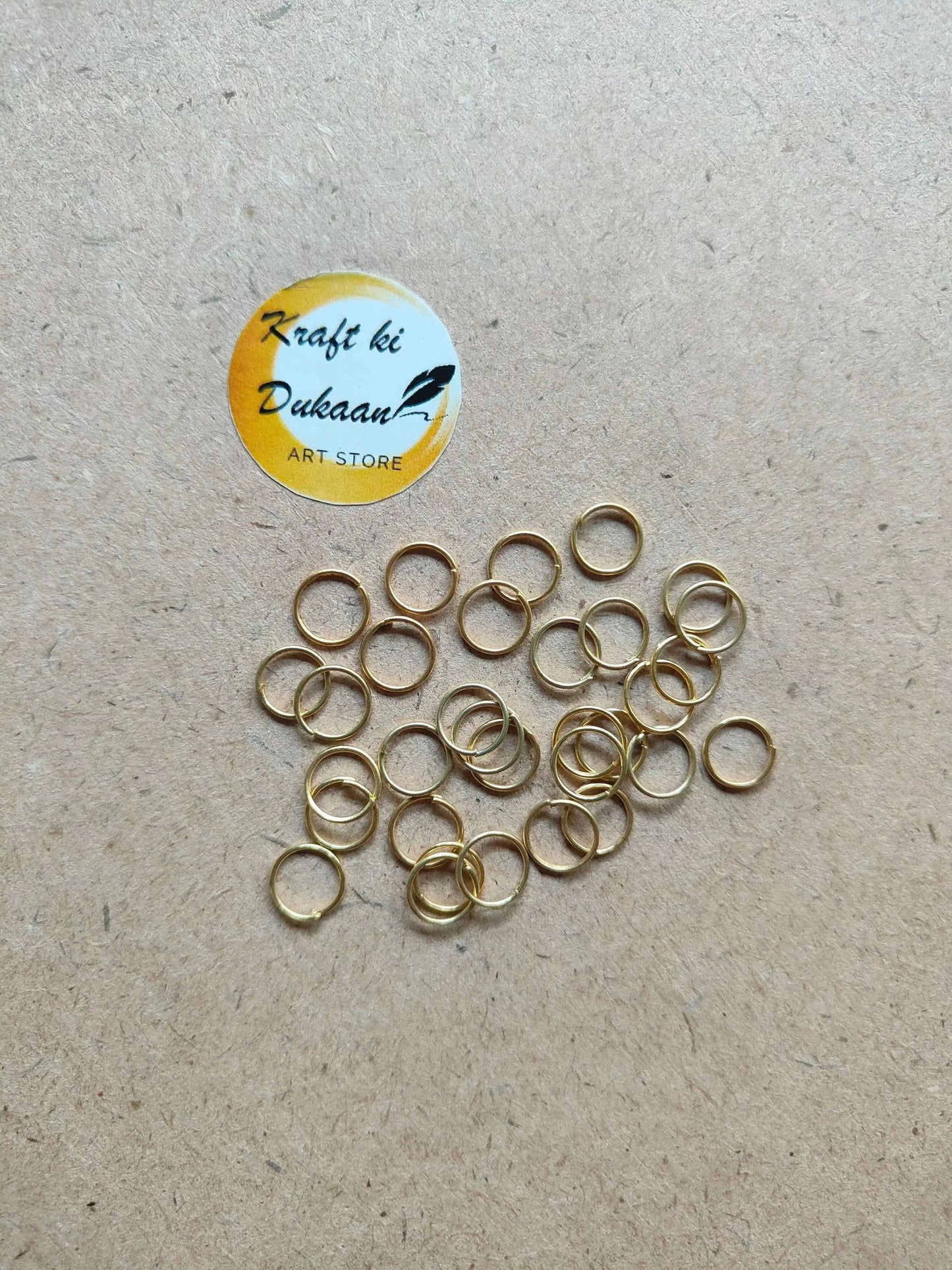 Golden metal ring hoops with open centers, mixed overlapping rings