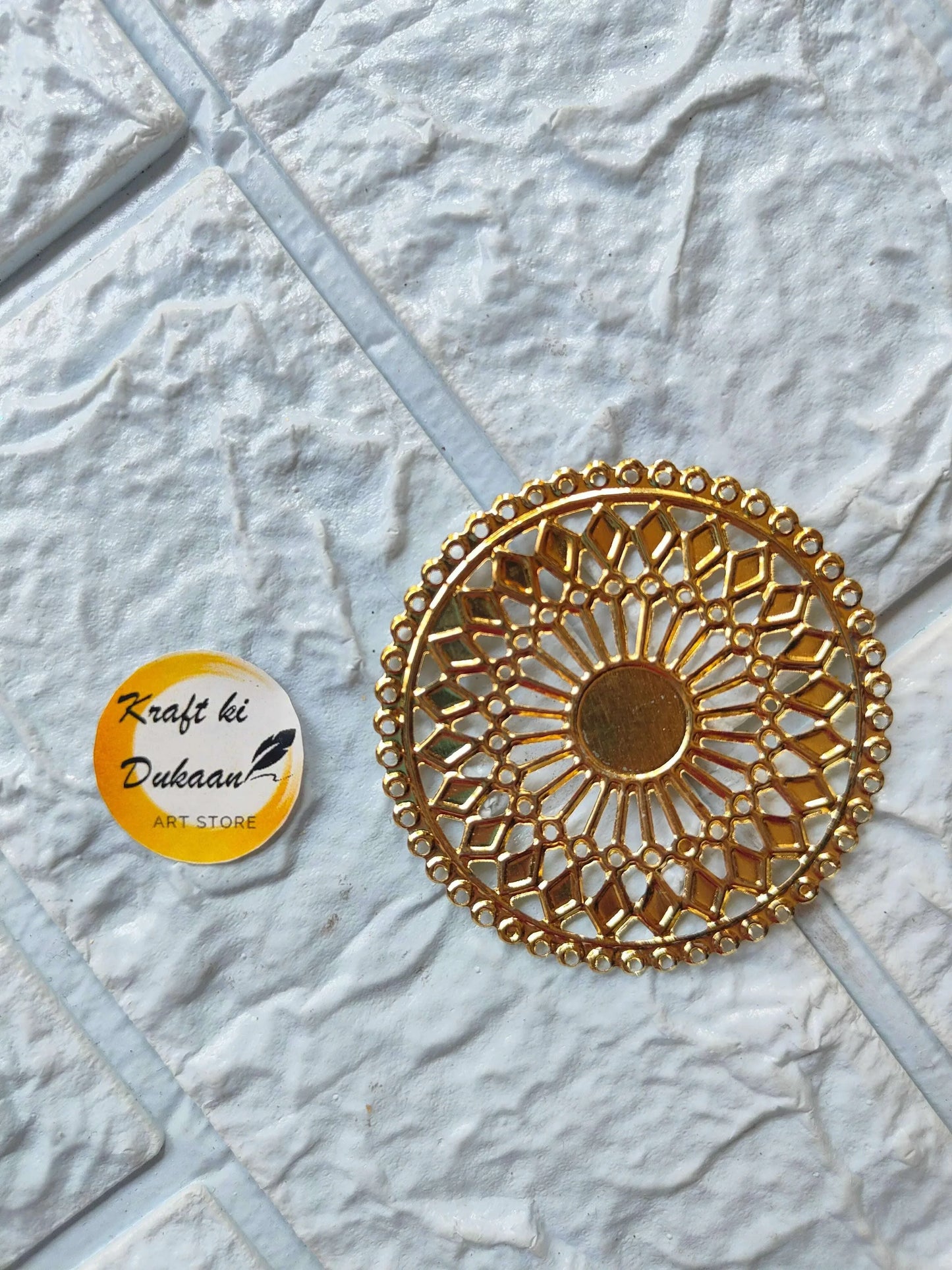 Golden round t-light metal plate with intricate lace-style cutout pattern