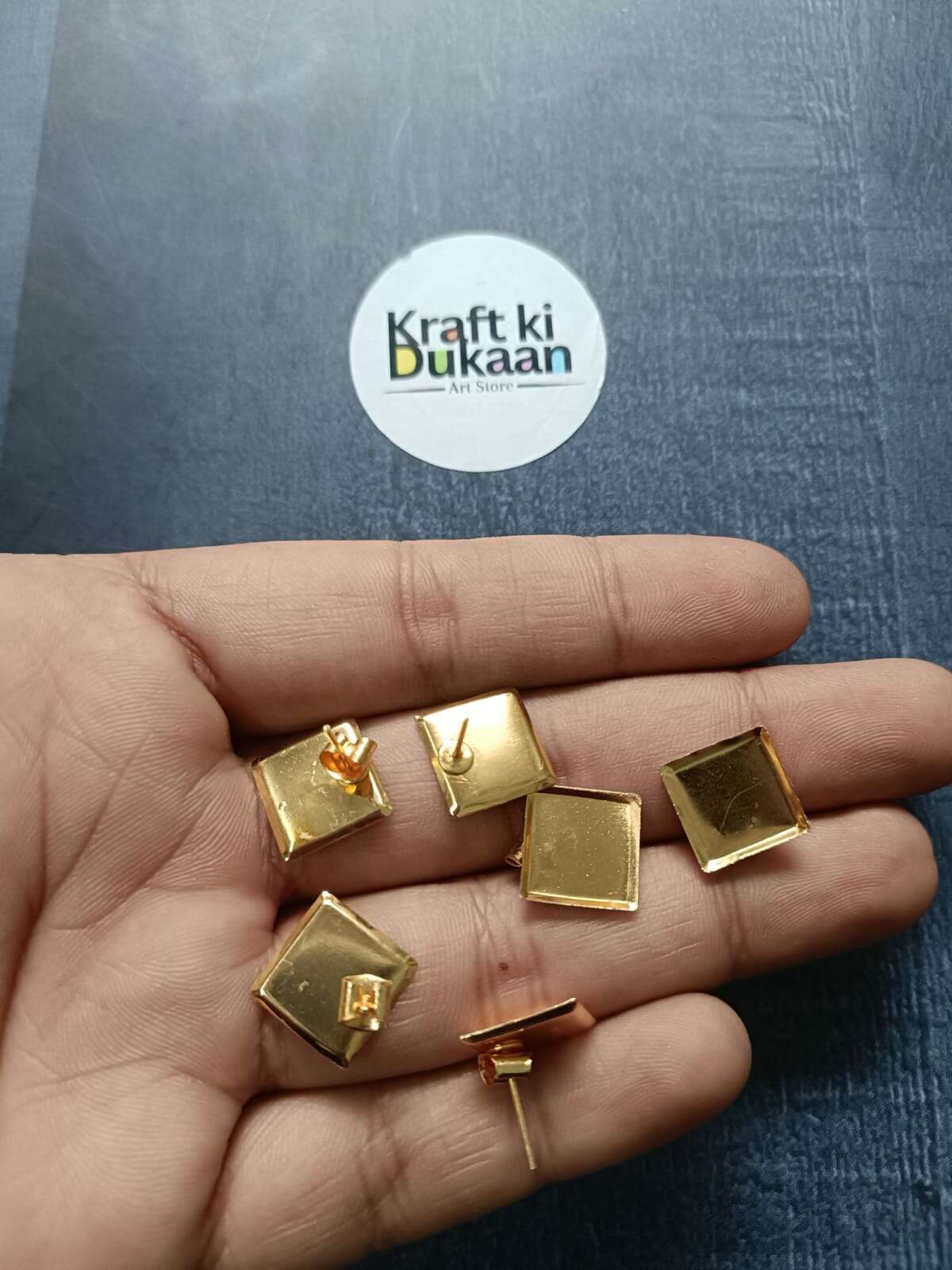 Golden square earring base with gold-tone stud backings and posts
