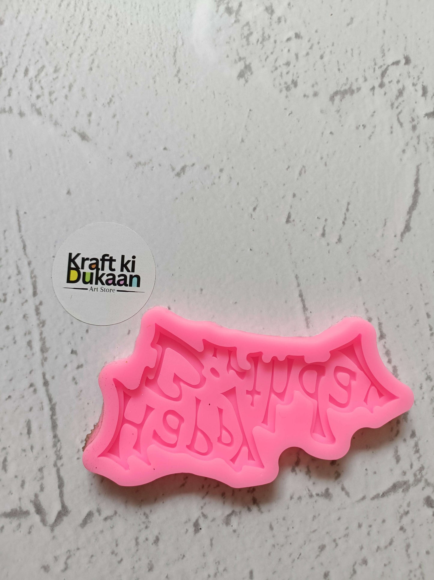 Pink “Happy Birthday” silicone mould with raised lettering