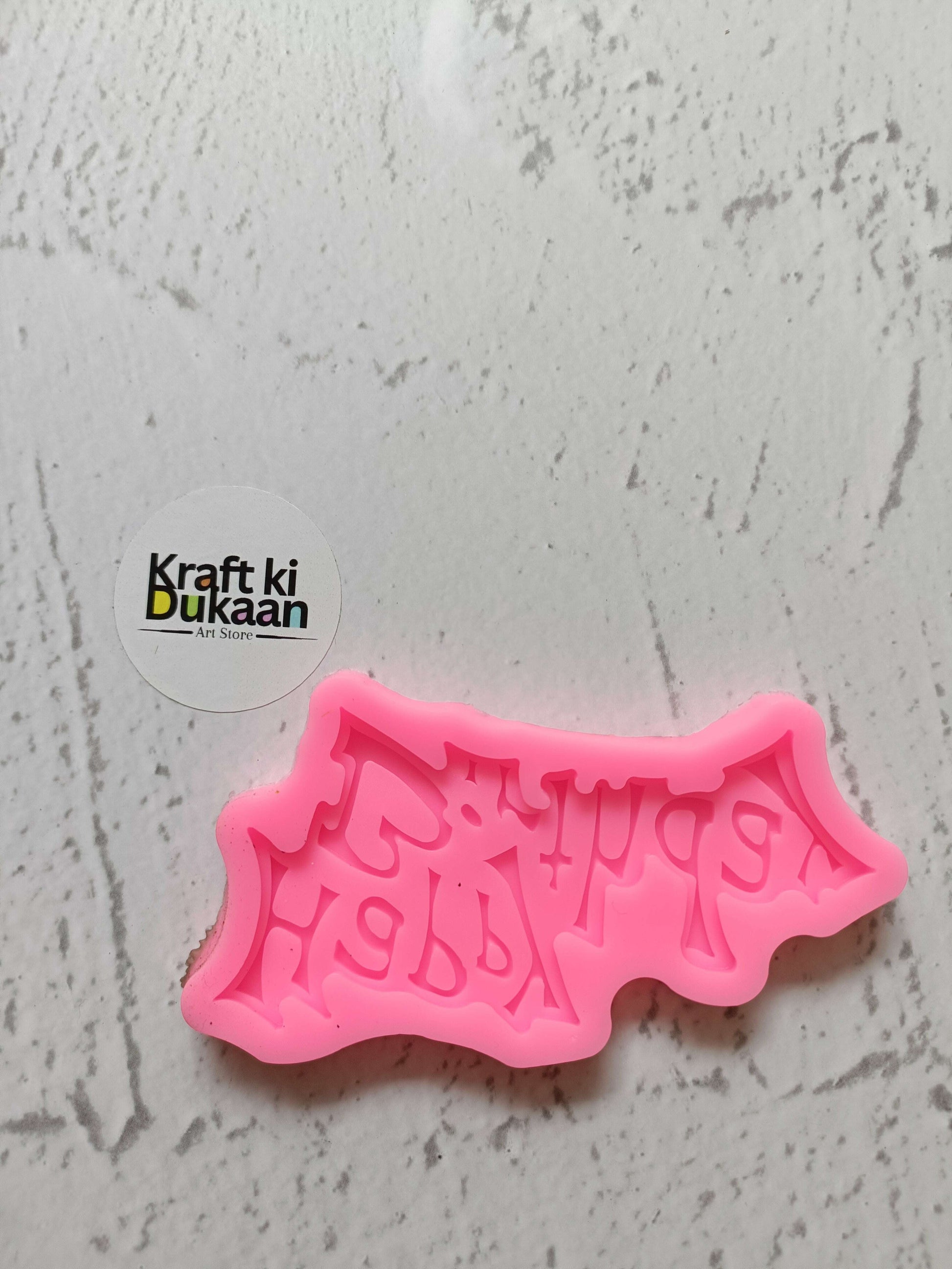 Pink “Happy Birthday” silicone mould with raised lettering