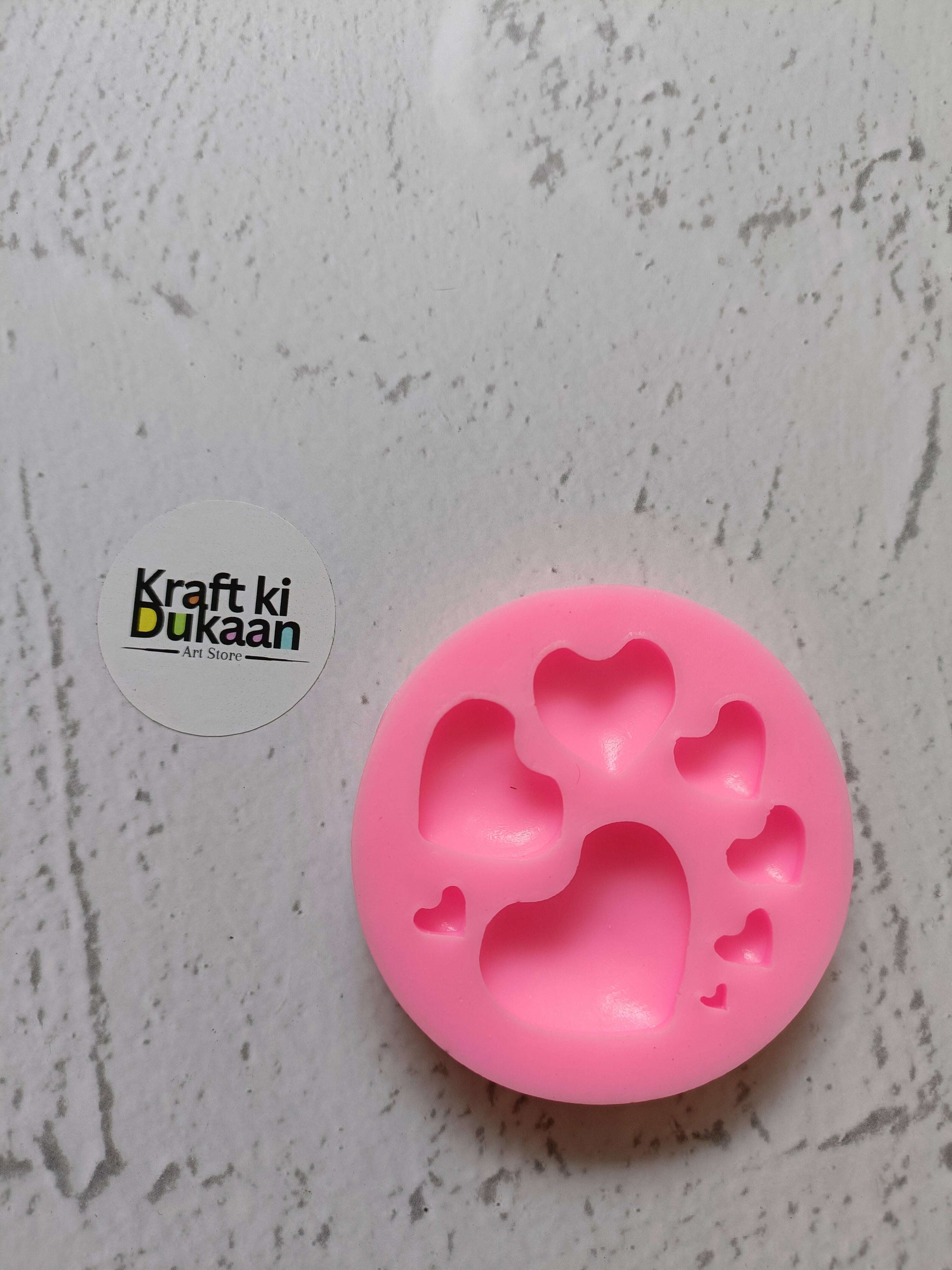 Pink silicone mold with 8 cavity heart shapes