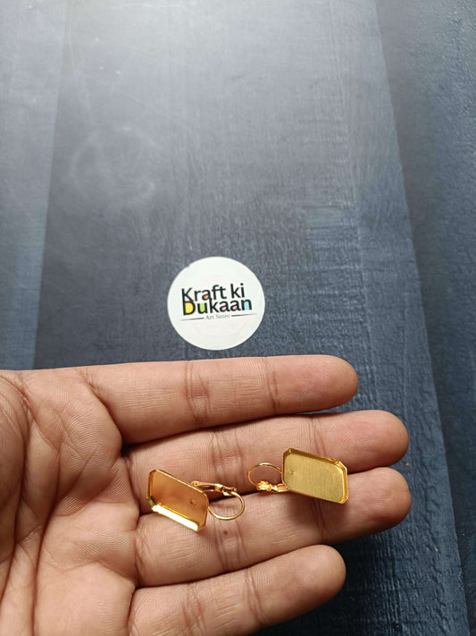 Octagon earring bases, gold-tone with small loops, shown in hand (pack of 2)