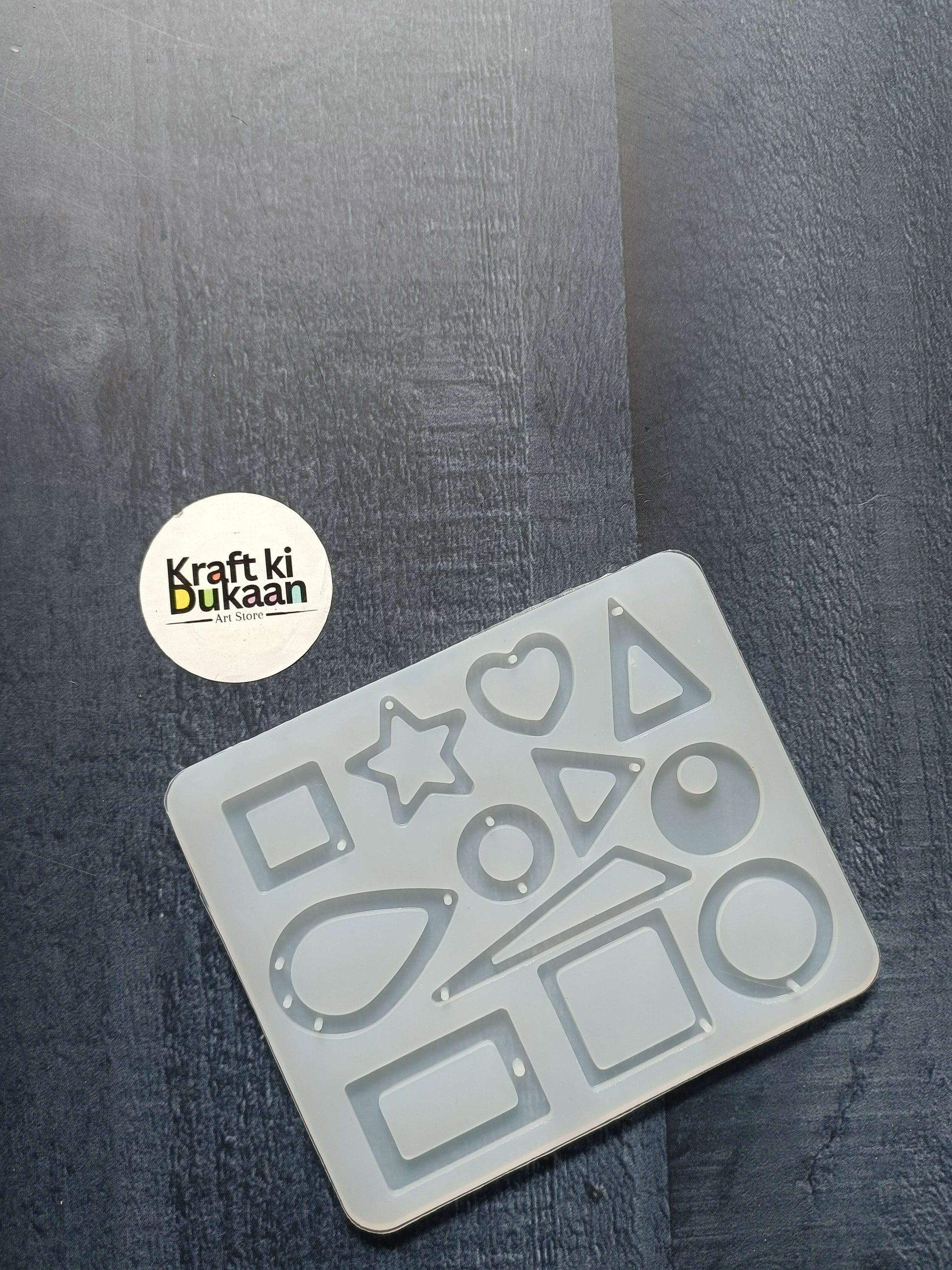 12-cavity jewellery mould with assorted geometric and heart shapes