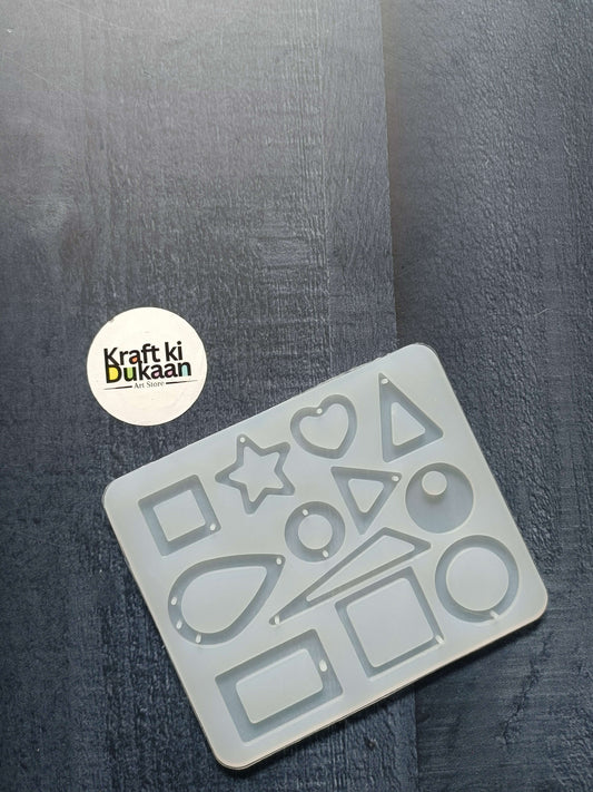 12-cavity jewellery mould with assorted geometric and heart shapes