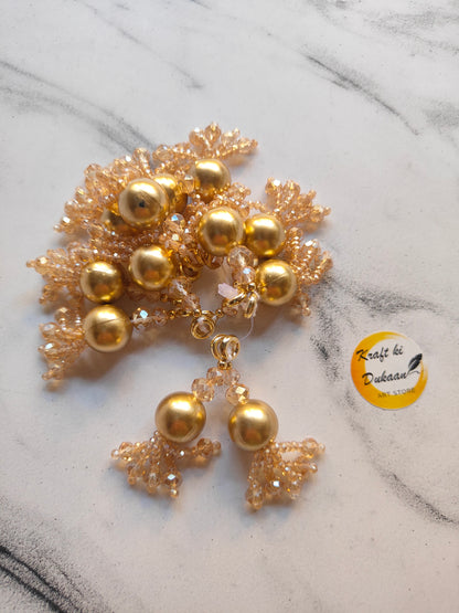 Beautiful golden latkan set for jewelry making featuring bead and lace details