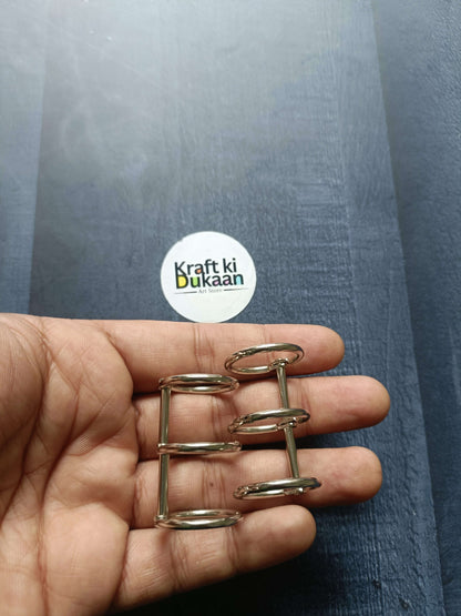 Silver 3-hole book ring pack of 2 in hand