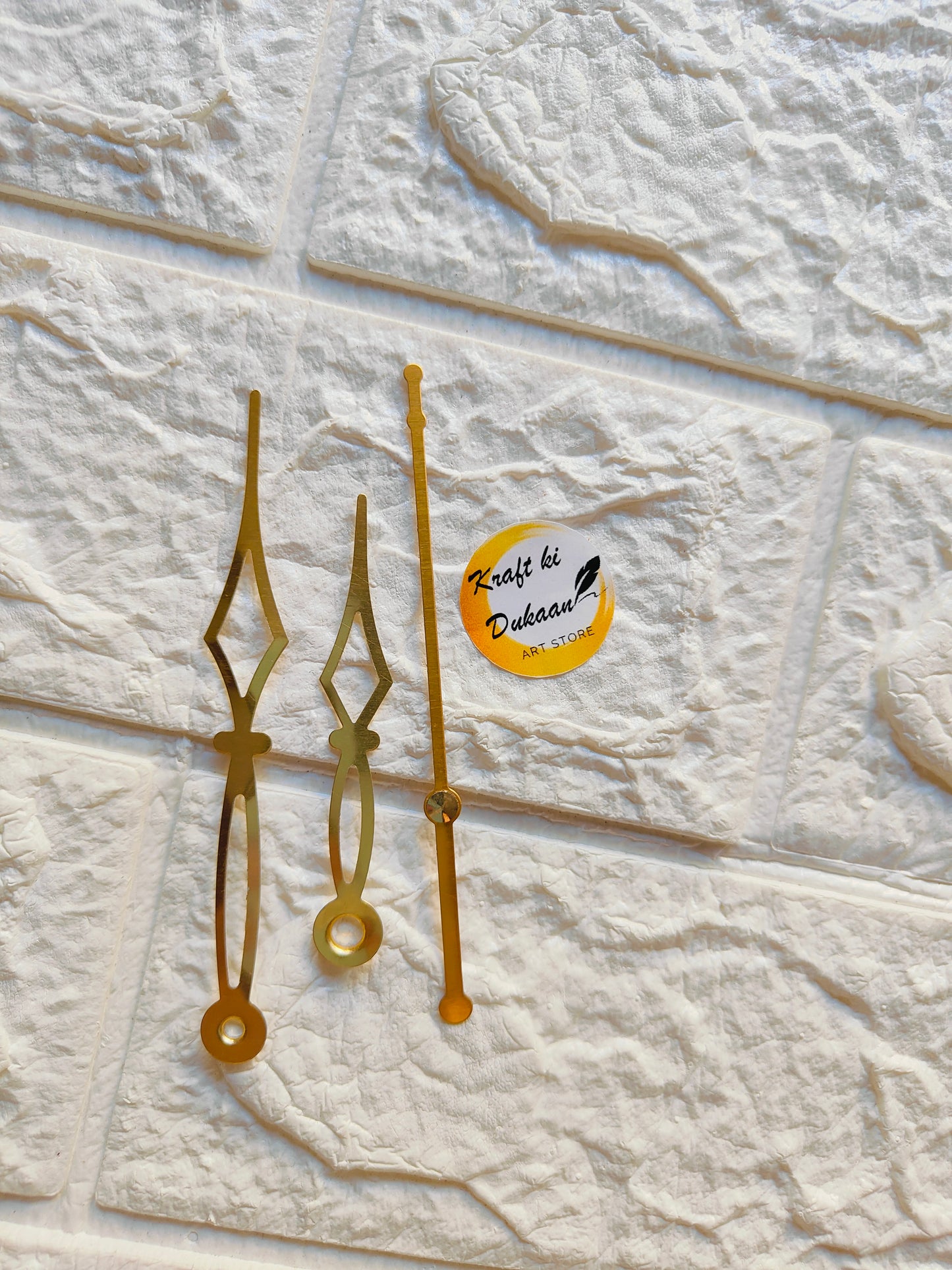 Set of gold metal clock hands for crafts, ideal for DIY clock projects and creative designs