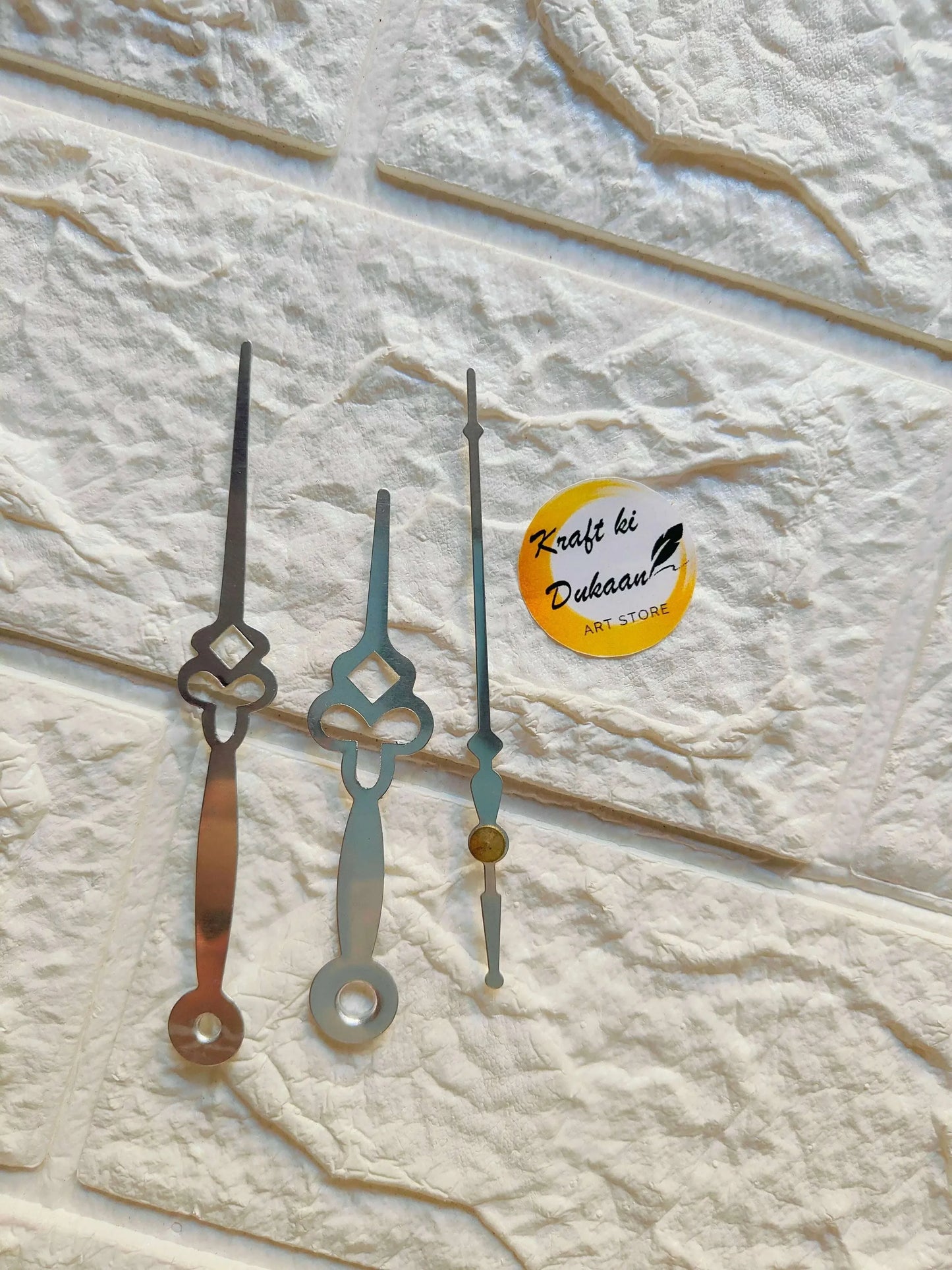 Metal clock hands set, black and light hands with yellow center detail
