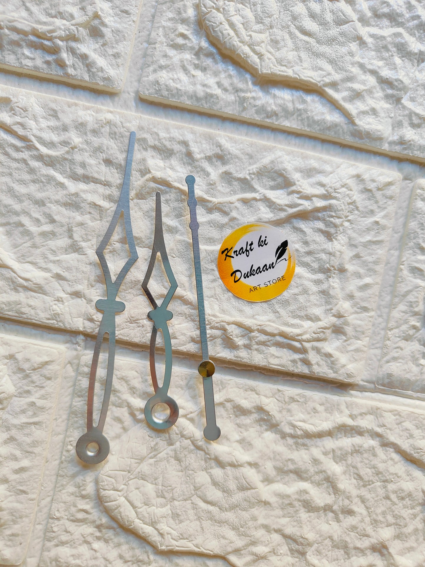 Set of metal clock hands for crafts in silver finish, ideal for DIY clock projects