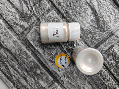 Kraft ki Dukaan Pearl Pink Mica Powder for Resin Art in a small jar on a textured surface