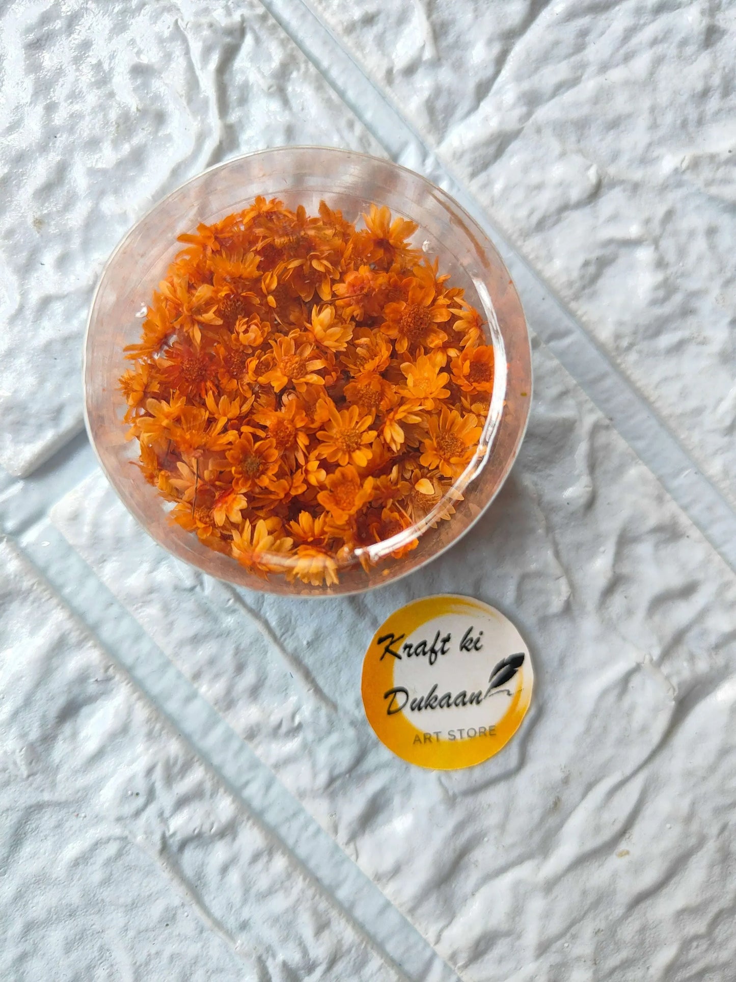Mini Natural Dried Flower Box with orange dried flowers in round clear lid