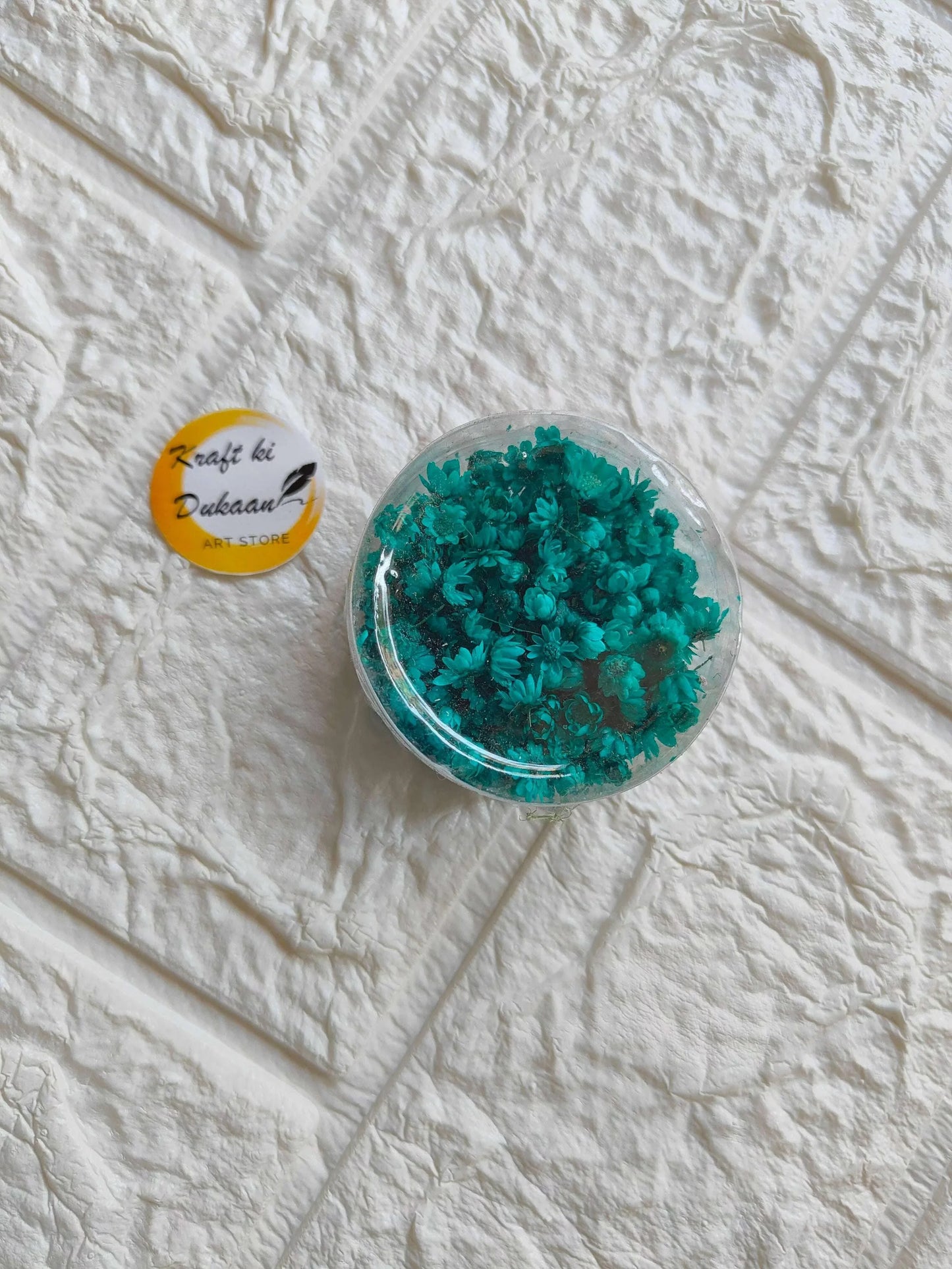 Mini Natural Dried Flower Box with teal blue dried flowers in round clear lid