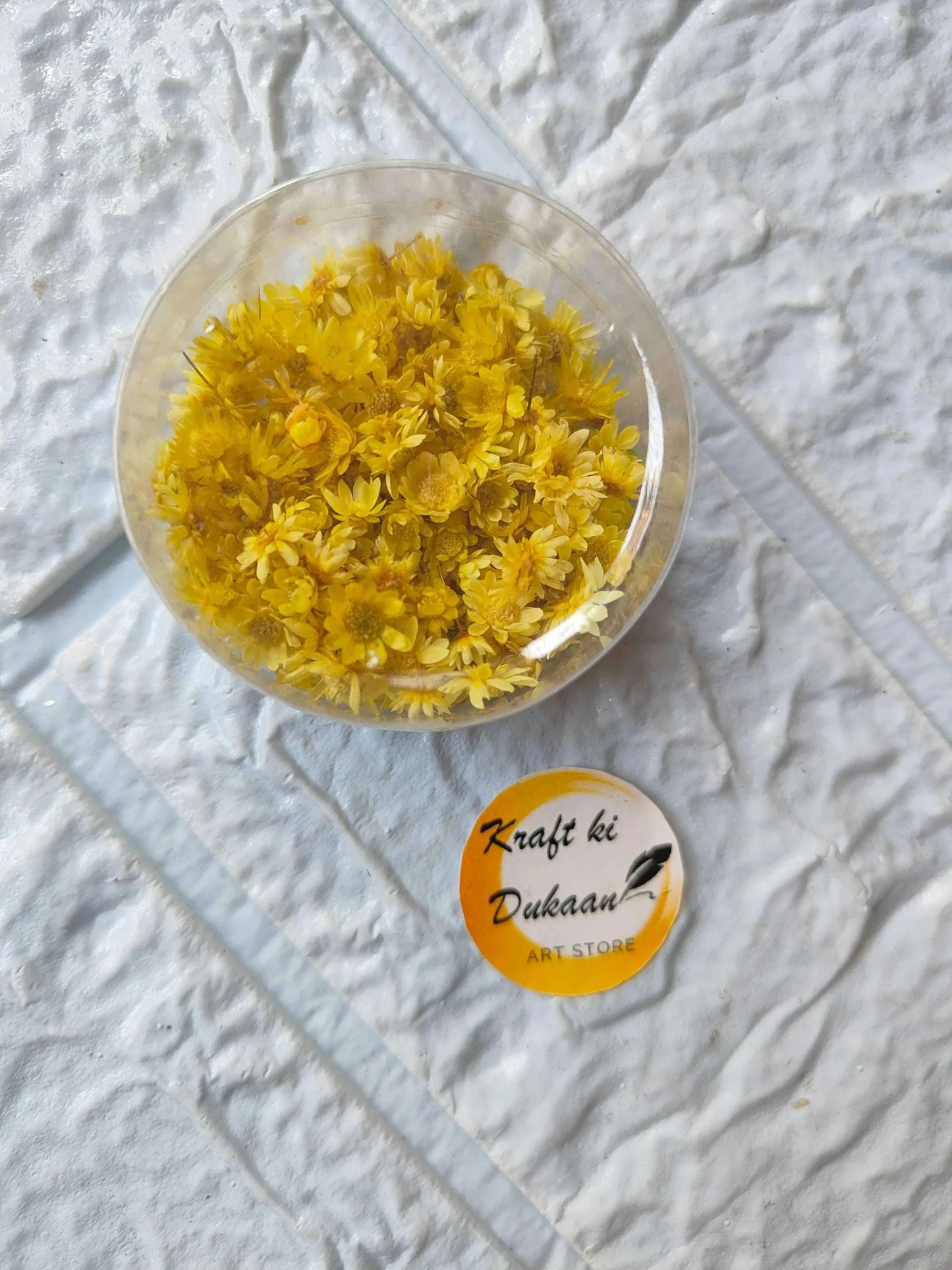 Mini Natural Dried Flower Box with yellow dried flowers in round clear lid