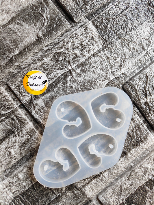 Silicone mother baby pendant mould with four heart shapes for crafting and jewelry making projects