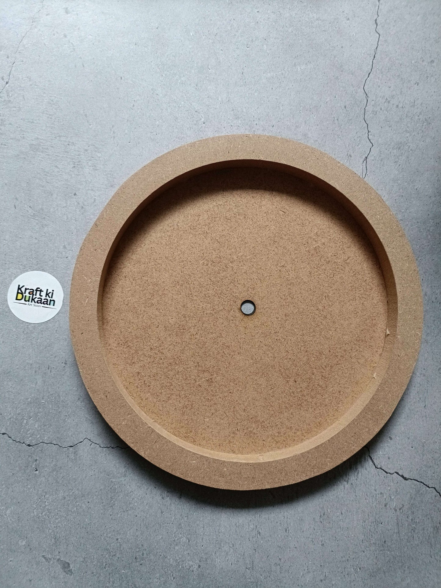 Round MDF wall mural center disk with small metal hanging hole, kraft brown