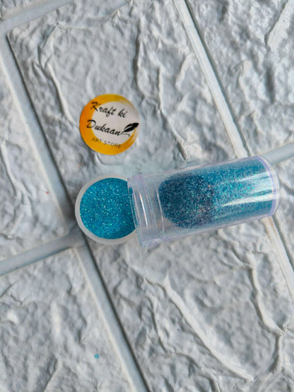 Neon glitter tube in turquoise blue with matching round glitter cap