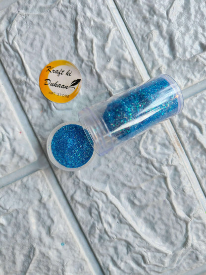 Neon glitter tube in deep blue with matching round glitter cap