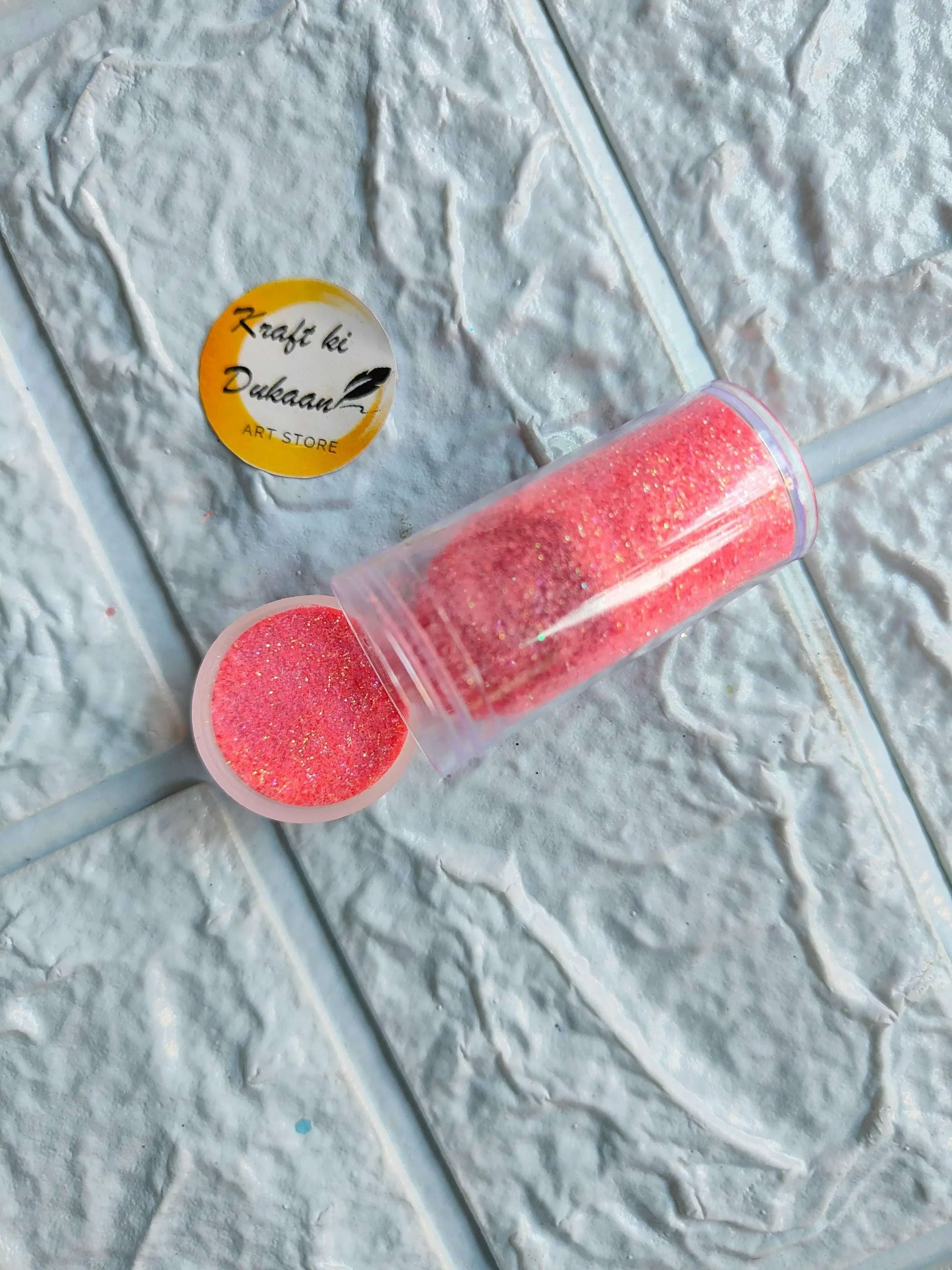 Neon glitter tube in hot pink with matching round glitter cap