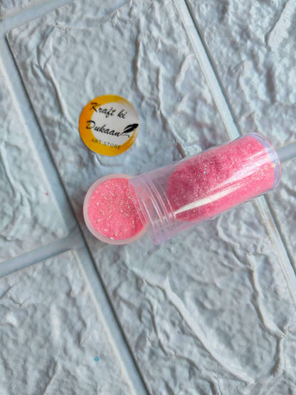 Neon glitter tube in bright pink with matching round glitter cap