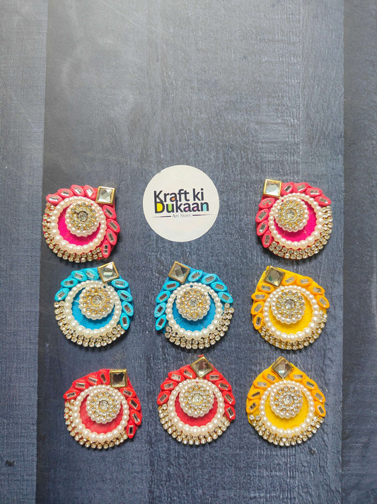 Colorful decorative patches in red, blue, yellow, and gold for DIY crafts and embellishments