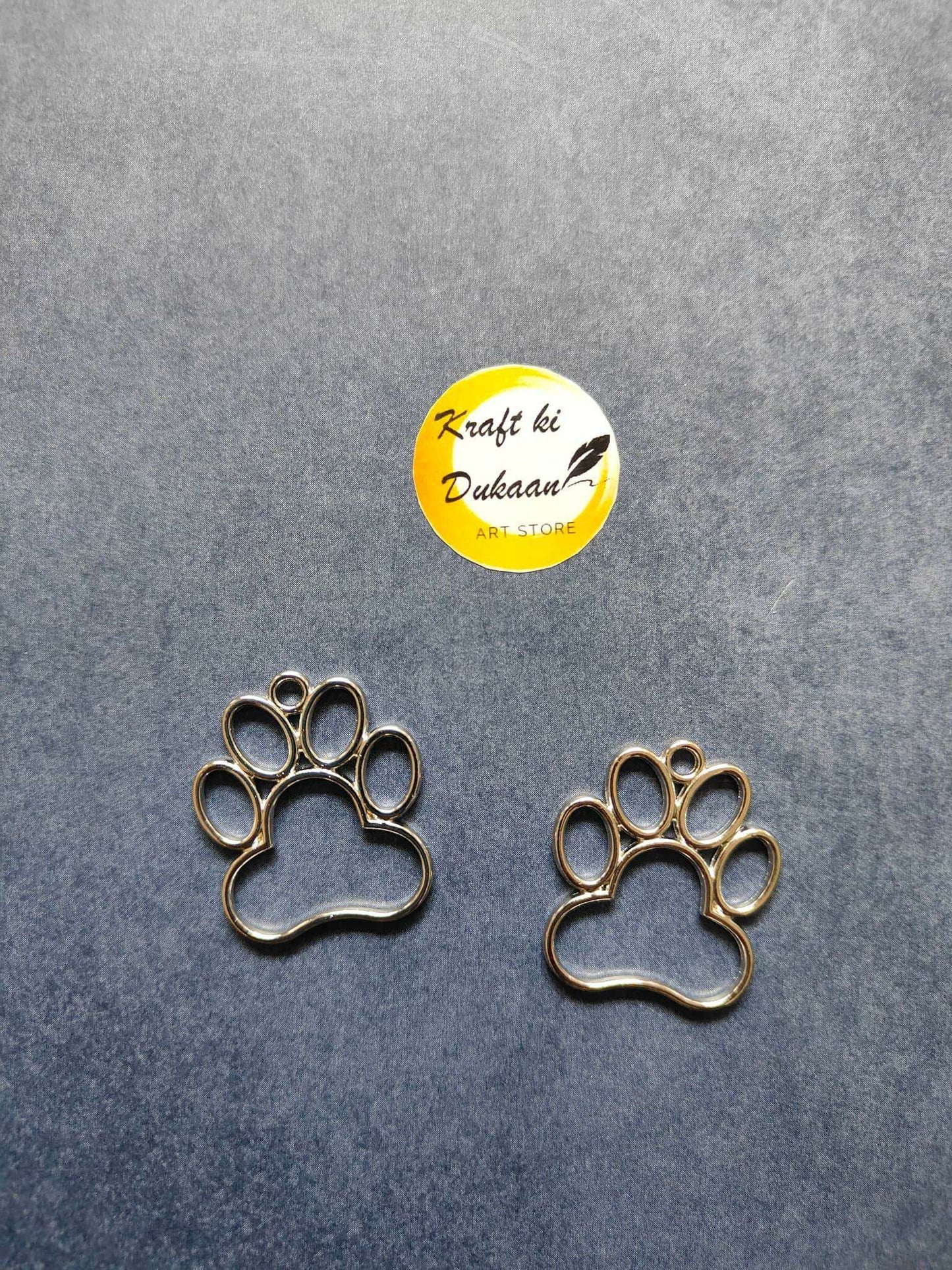 Silver paw bezel pendant with round bezel paw print, single charm