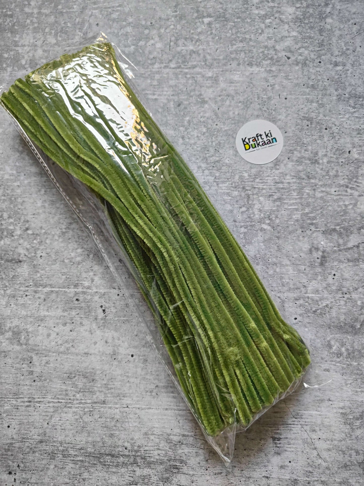 Olive green plain pipe cleaners, pack of 100, bundled in clear plastic wrap