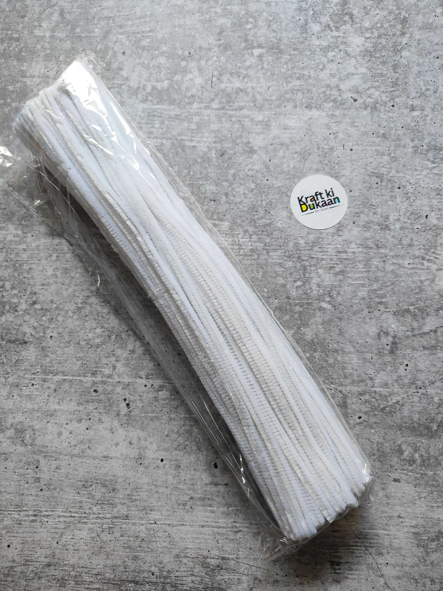 White plain pipe cleaners, pack of 100, bundled in clear plastic wrap