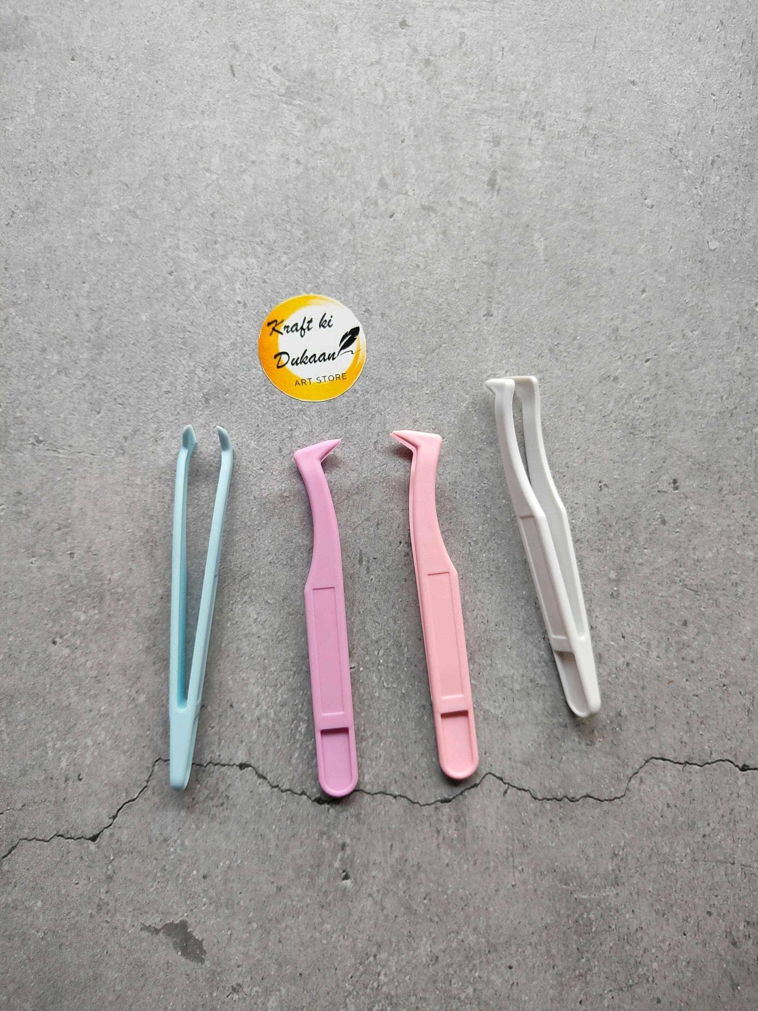 Plastic Tweezer A9: 4 plastic tweezers, blue, purple, pink and white.