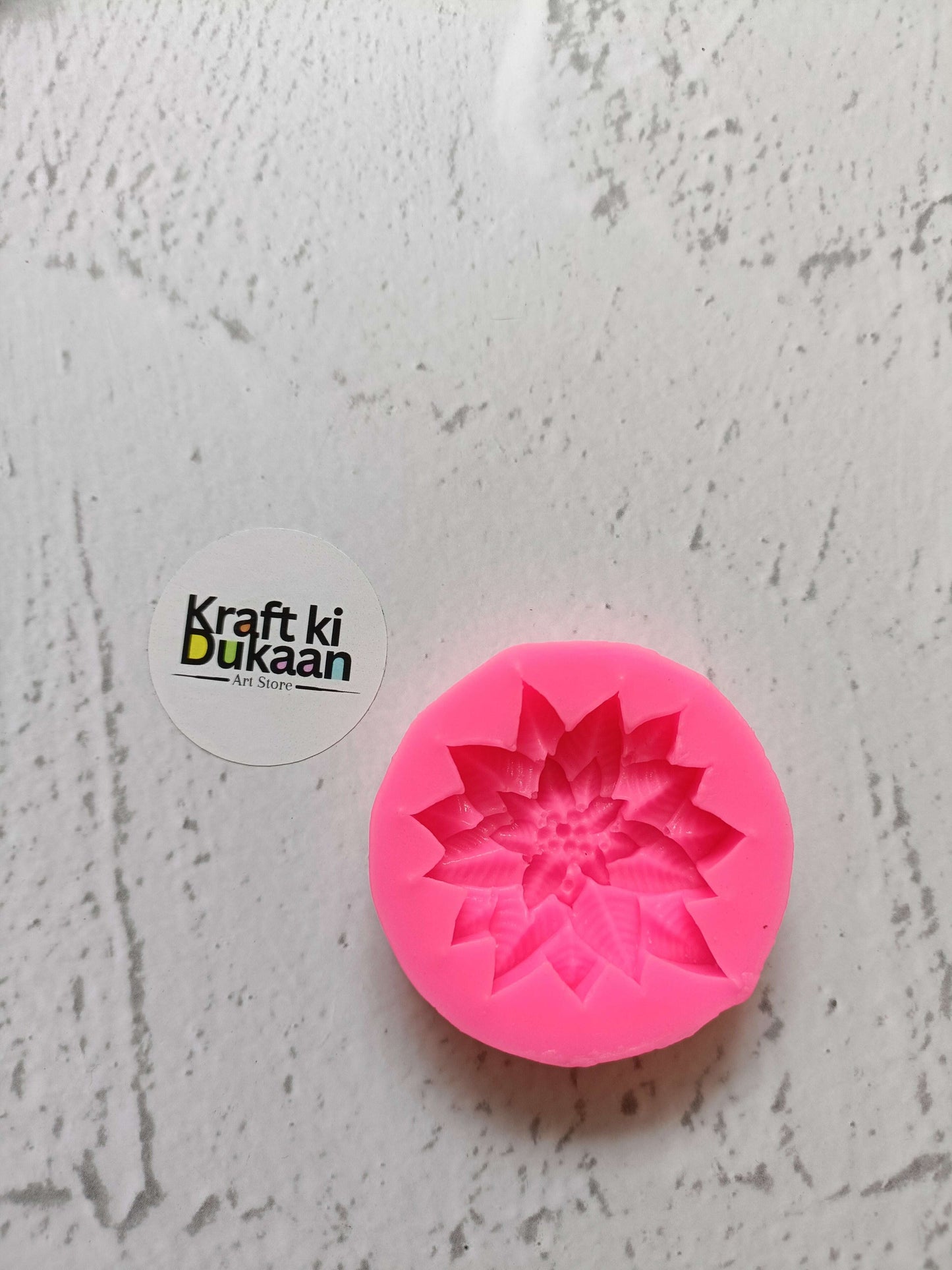 Poinsettia Flower Pink Mould: pink silicone flower mold with circular petal pattern