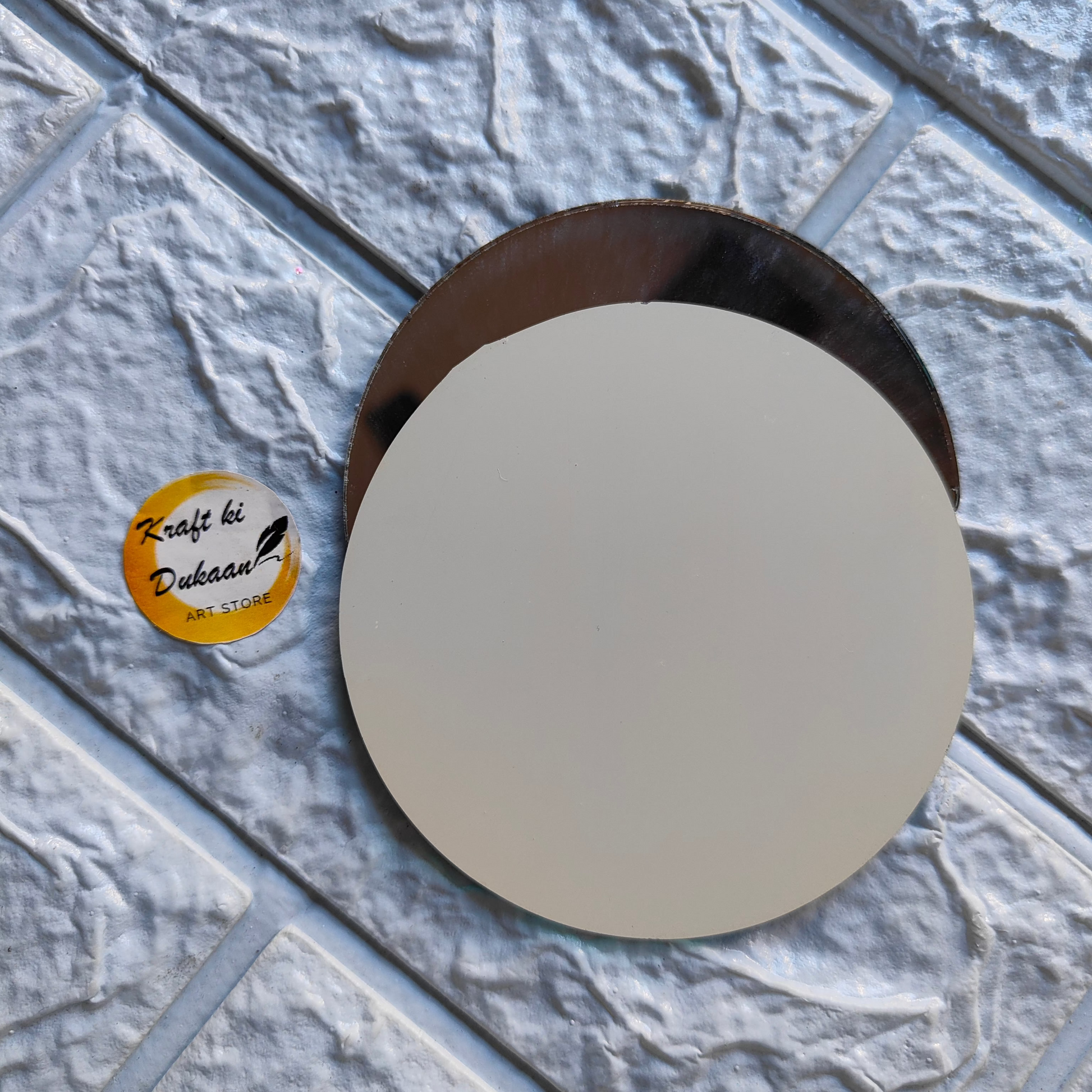 Round glass mirror mosaic with a sleek design for home decor and enhancements