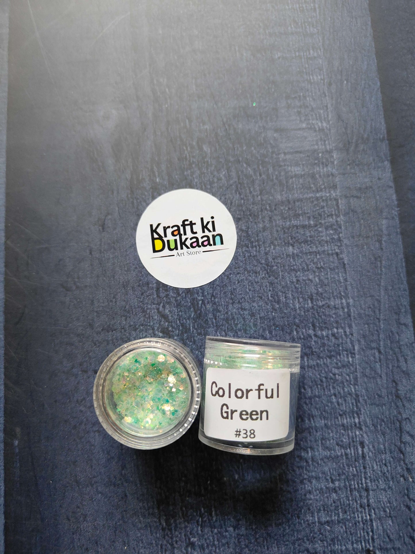 Shimmer glitter in Colorful Green, jar with label #38 visible