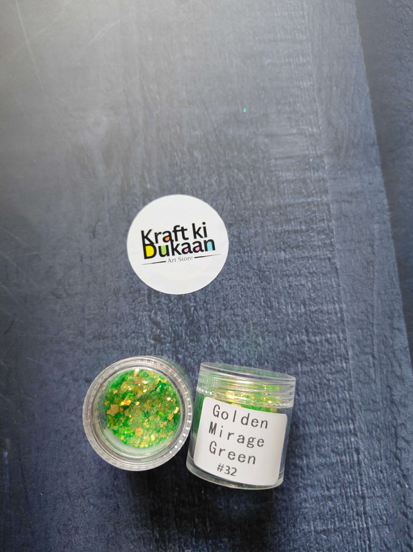 Shimmer glitter in Golden Mirage Green, jar with label #32 visible